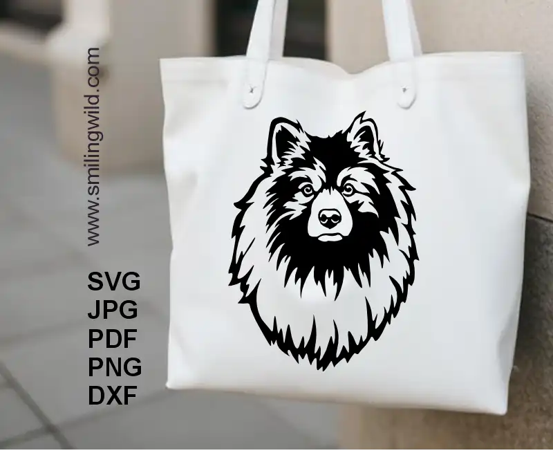 A tote bag with a Realistic peeking Keeshond dog vector portrait in black on it, perfect for Cricut and laser cut crafts