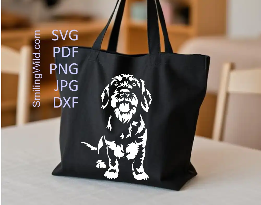 Wirehaired dachshund full body sitting SVG and DXF white vector file presented on a black tote bag to show white file usage on dark surfaces.