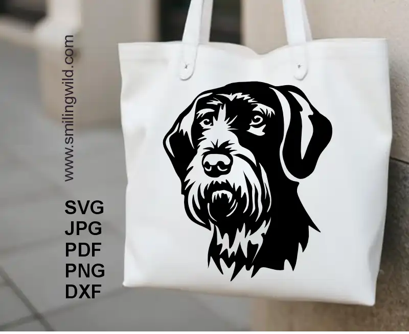 A white tote bag with application of a German Wirehaired Pointer face graphic in SVG PNG DXF – Cricut-friendly dog face file for crafting