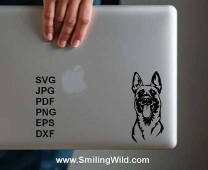 A sample image of  Malinois clipart displayed a laptop sticker for pet logos, Cricut crafts, and personalized engraving projects
